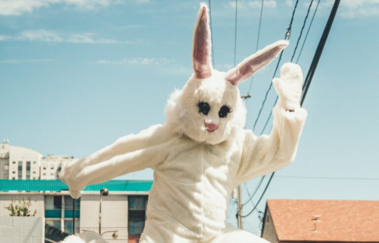 man in bunny costume in mid air in time lapse photography