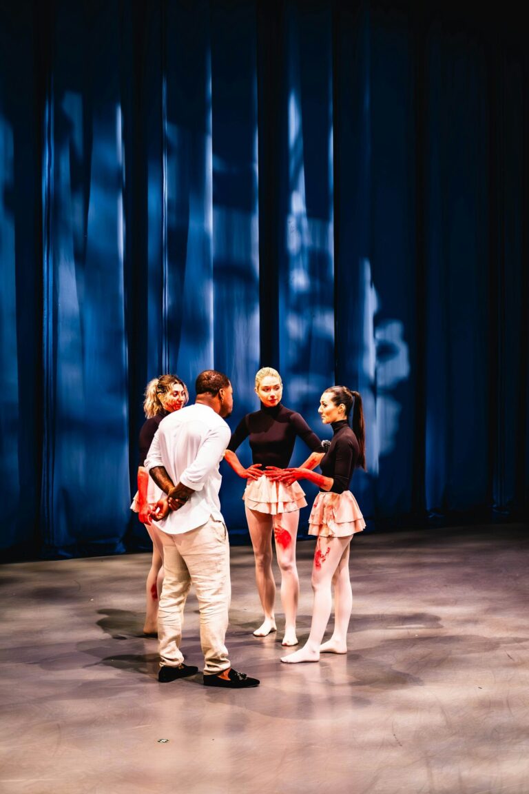 A group of people standing on top of a stage