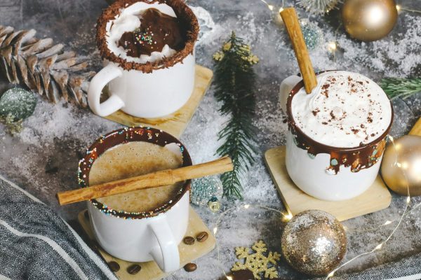 white ceramic mug with coffee on table