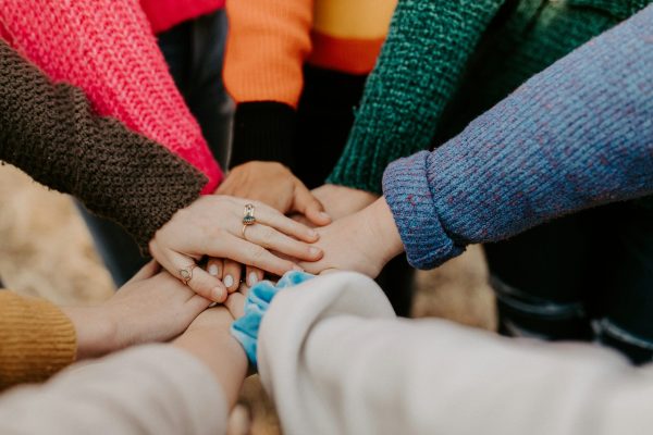 group of people holding hands